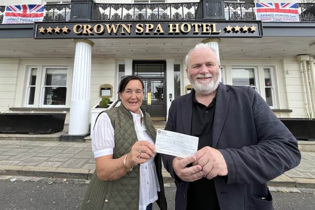 Shirley Smith, President of the Scarborough Hospitality Association, donating a cheque to Kane Cunningham, co-director of the Big Ideas By The Sea Festival,