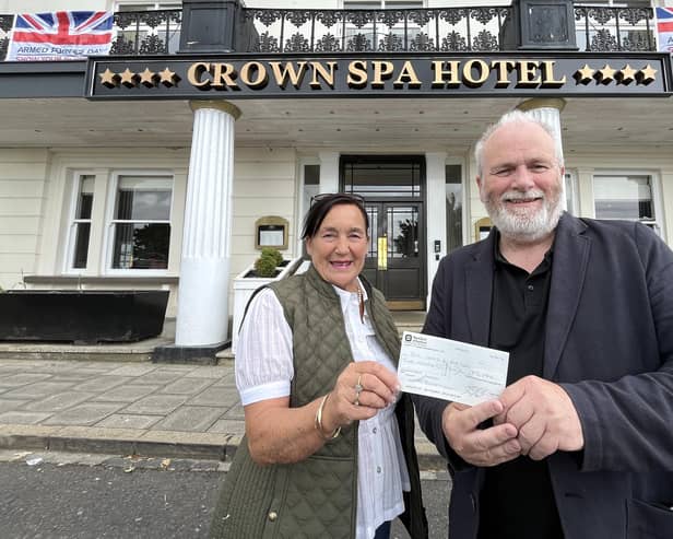 Shirley Smith, President of the Scarborough Hospitality Association, donating a cheque to Kane Cunningham, co-director of the Big Ideas By The Sea Festival,
