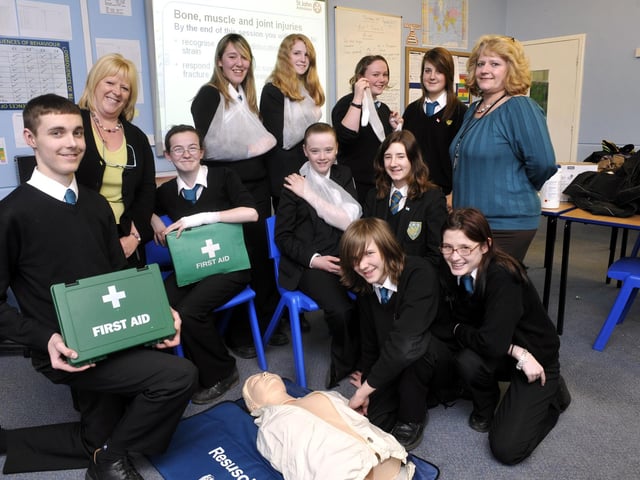 Scalby School pupils taking part in the launch of the Young First Aiders course. From left, back, Billie Dunster, Hannah Gillard, Katie Millward, Emily Schneider, teacher Lynn Walsh, front, David Sessions, teacher Kath Baggallay, Sammi Lee, Terri Marshall, Jamie Ellis, Matthew Wright, and Toni-Roxanne Rennison.     100448a