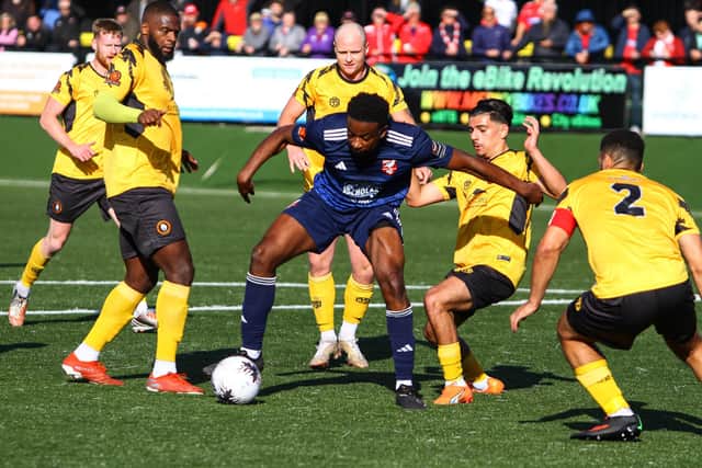 Kieran Weledji is surrounded by Rushall players in the National North clash.