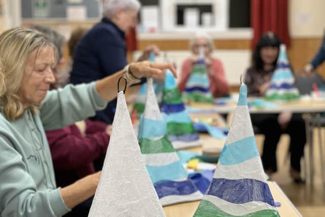 Community groups creating lanterns for the parade which marks the start of Scarborough Sparkle. Credit – Animated Objects.