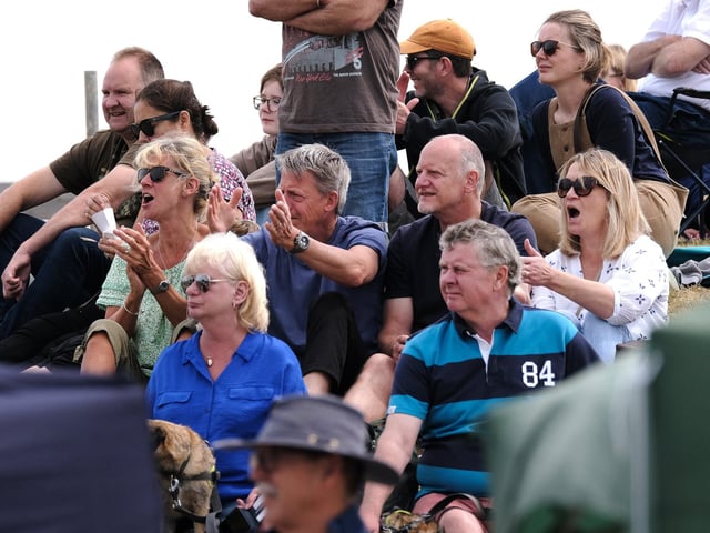 Excitement in the crowd as they cheer on the paddlers!