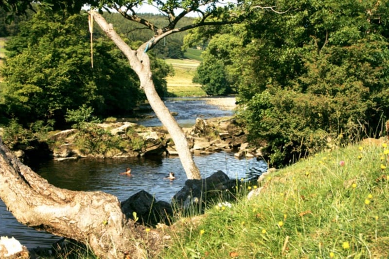 The River Wharfe is one of the best wild swimming rivers in the Dales. Burnsall is one of its most popular wild areas with pools and rapids.
The village post office even sells rubber rings.