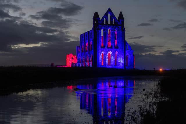Whitby Abbey illuminated over the Halloween half-term.  Picture Bruce Rollinson.