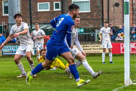 Stephen Walker (No 9) opens the scoring for Whitby Town as they defeated a young Macclesfield side 2-0 on the final day of the season. PHOTOS BY BRIAN MURFIELD