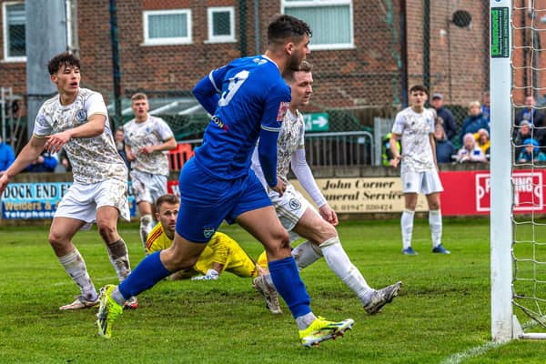 Stephen Walker (No 9) opens the scoring for Whitby Town as they defeated a young Macclesfield side 2-0 on the final day of the season. PHOTOS BY BRIAN MURFIELD