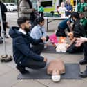 A St John volunteer demonstrates CPR