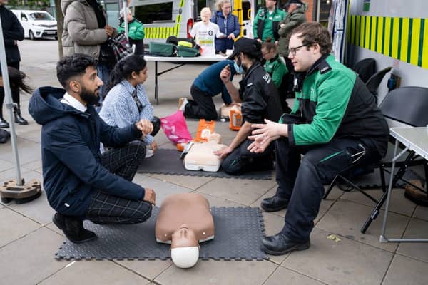 A St John volunteer demonstrates CPR
