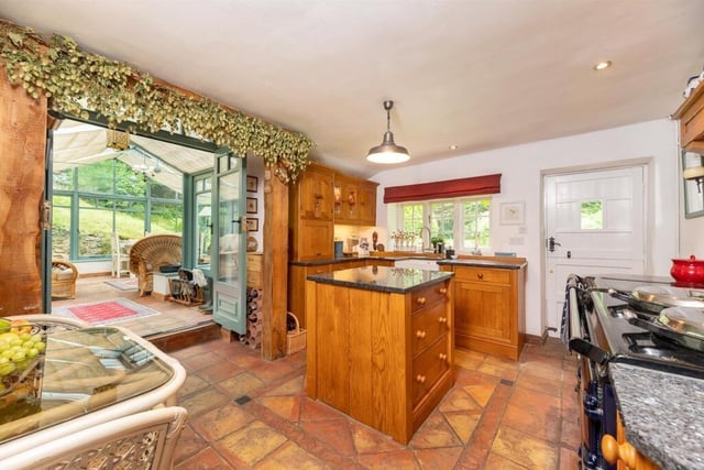 The bespoke, handmade kitchen has an array of high end appliances.