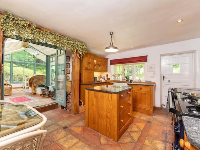 The bespoke, handmade kitchen has an array of high end appliances.