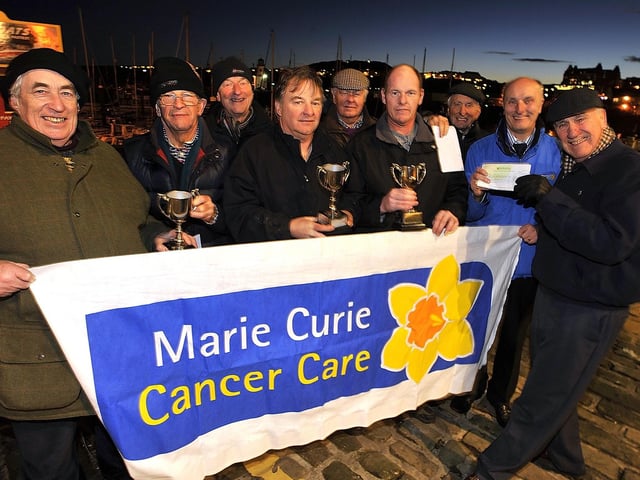 The winners of the harbour boat lights competition pick up their trophies from the Sons of Neptune and Marie Curie receive a cheque for £500 from the proceeds of the annual competition. Picture by Neil Silk=