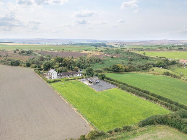 An aerial view of the property and the scenery that surrounds it.