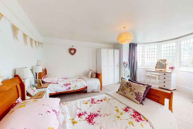 There is room for two double beds in this lovely bedroom with bay window.