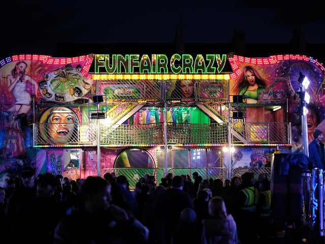 The Funfair Crazy ride lights up the fair.