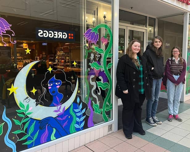 Members of the Bridlington YWCC alongside their stunning artwork in honour of International Women's Day.