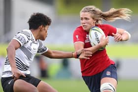 Zoe Aldcroft of England breaks a tackle to score a try during the Rugby World Cup 2021 win for England against Fiji at Eden Park (Photo by Phil Walter/Getty Images)