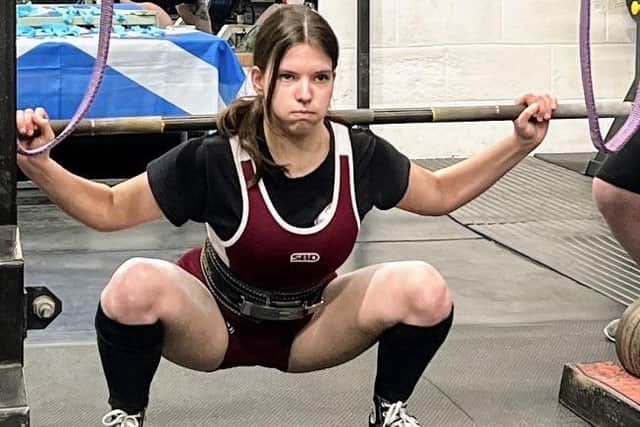 Maddie Watling showing fantastic form on her first competition squat.