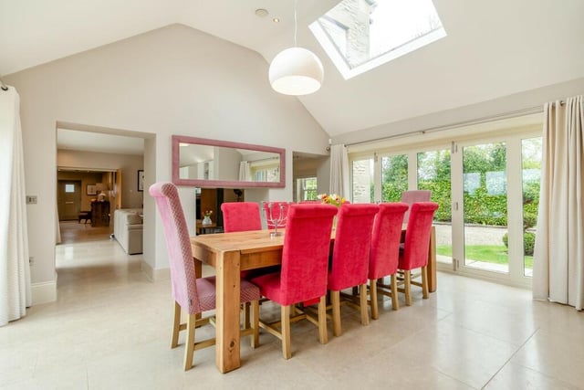 The open plan dining area has doors out to the garden.