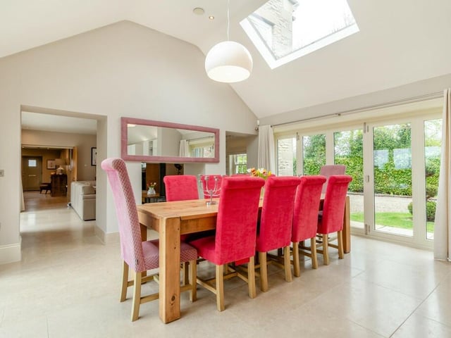 The open plan dining area has doors out to the garden.