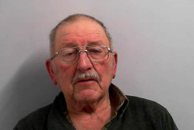 Sex offender John Dowson pictured in police custody.