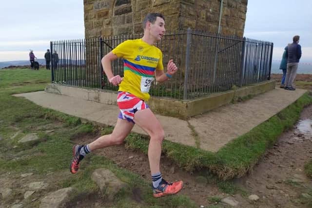 Scarborough Athletic Club's Dan Bateson at the Monument, on his way to earning seventh place at the New Year's Day Captain Cook's Fell Race..