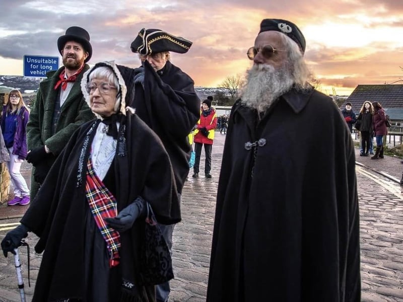 Costumed characters at the seaside village's annual pre-Christmas event.