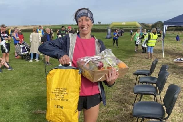 Rhona Marshall shows off her winning bag of potatoes at Kilham