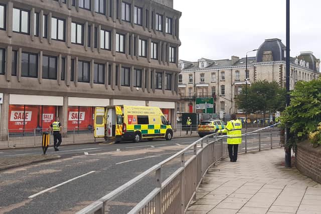 A large number of emergency service personnel are at Pavilion Terrace