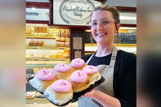 Andrea Burrows, Shop Assistant, holding a tray of limited edition pink Whitby Lemon Buns in Botham's of Whitby's Skinner Street shop.
