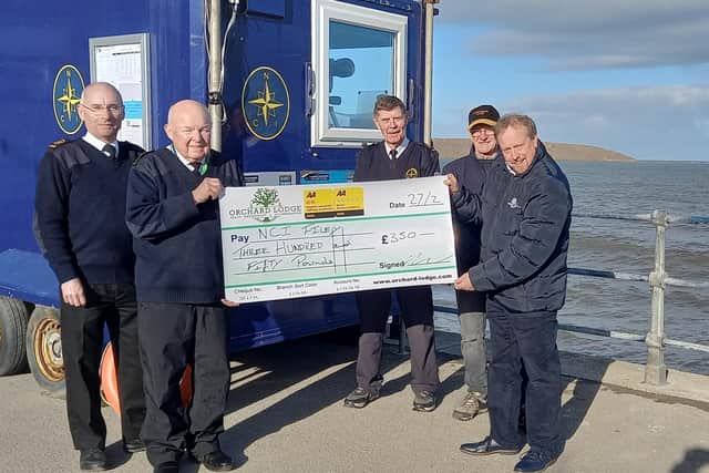 A £350 cheque raised from Orchard Lodge's Celebration of the North Sea event, is presented to NCI in Filey.