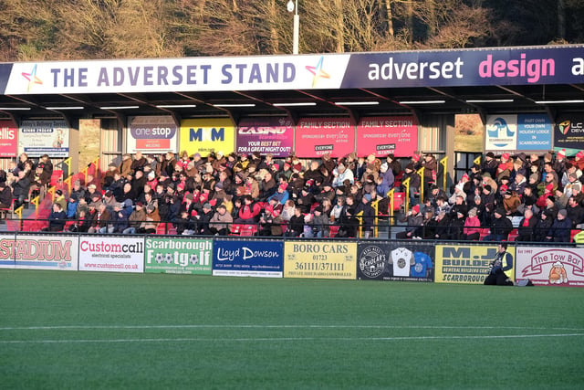 The Scarborough Athletic supporters cheer on the home side.