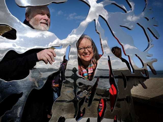 Invisible Dust founder Alison Sharp looks through the sculpture