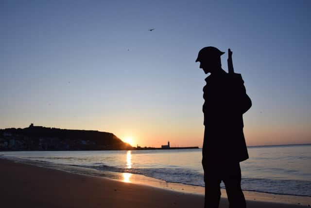 A cardboard depiction of a soldier at sunrise on Scarborough’s South Bay. Photo: The Animated Objects Theatre Company