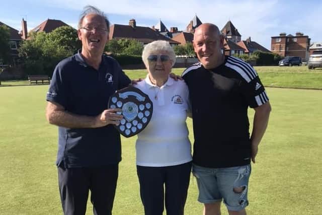 From left, Whitby’s Bedlington Shield Singles Merit winner Robert Child, Whitby BC president Betty Sewell and runner-up Andy Webb
