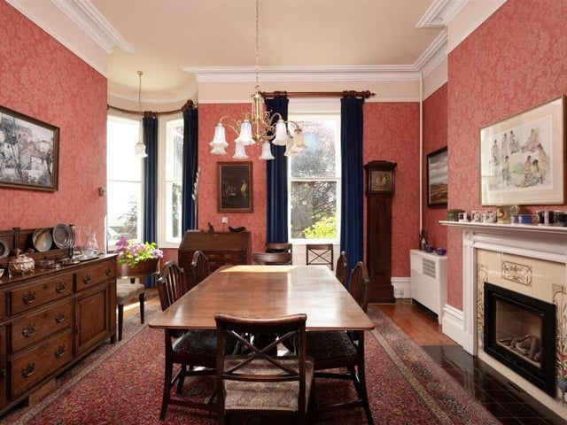 The well-lit dining room has space for a large table and chairs.