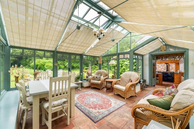 This lovely sun room asjoins the kitchen.