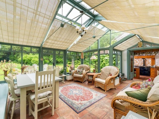 This lovely sun room asjoins the kitchen.