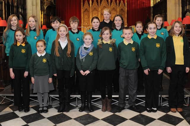 Local children sing at the Priory during the Dickensian Christmas festival in the Old Town. (PA1049-21m)