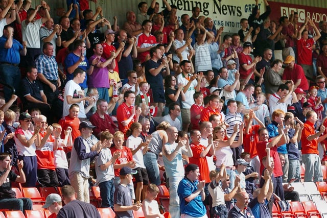 Do you recognise any of the fans celebrating in the Boro crowd after the hosts score against Woking in August 2004?