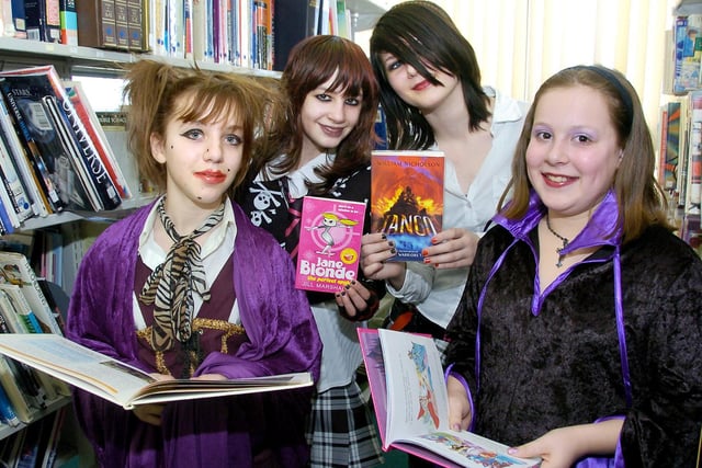 Pindar School held a book day event and are hoping to raise money for the library. Punkettes (left to right) Ellie-May Winters, Lauren Price, Rebecca Canner and Kayleigh Bradley in among the books. 081097c