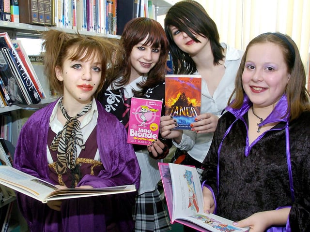 Pindar School held a book day event and are hoping to raise money for the library. Punkettes (left to right) Ellie-May Winters, Lauren Price, Rebecca Canner and Kayleigh Bradley in among the books. 081097c