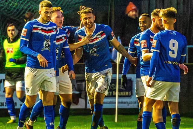 Skipper Dan Rowe, centre, celebrates the opening goal with his Blues team-mates in the 3-0 home win against Ilkeston Town on New Year's Day. PHOTO: BRIAN MURFIELD