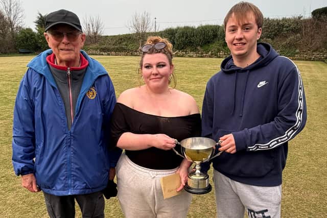 David Hill presents the North Cliff Drawn pairs Merit trophy to winners Katie Gates and Josh Emmerson.