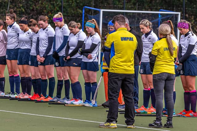 The players observe the two minutes silence for Remembrance Day.