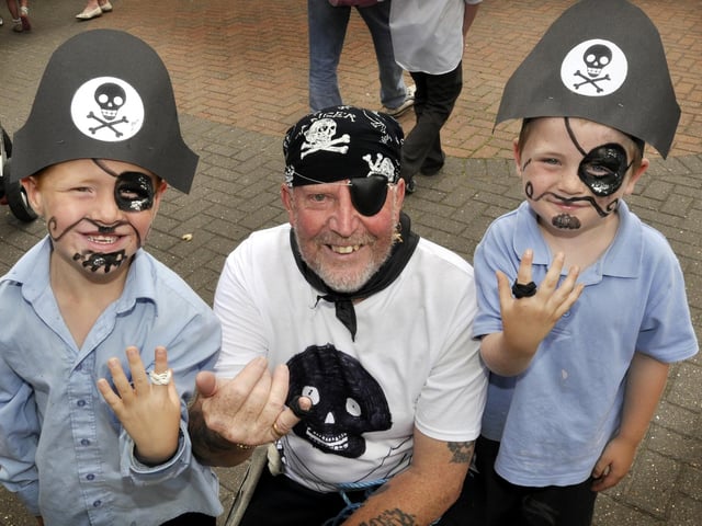 Pirate Captain Tony East of the Scarborough Maritime Heritage Centre with new crew members at Hinderwell School summer fair.