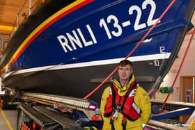Jason Webber at the Bridlington RNLI station in all of his gear.