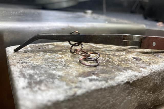 Prior to working with silver directly, participants tried their hands at making a copper chain link while getting used to soldering.