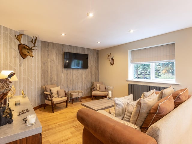 This lounge or living area is open plan to, but separate from the kitchen.