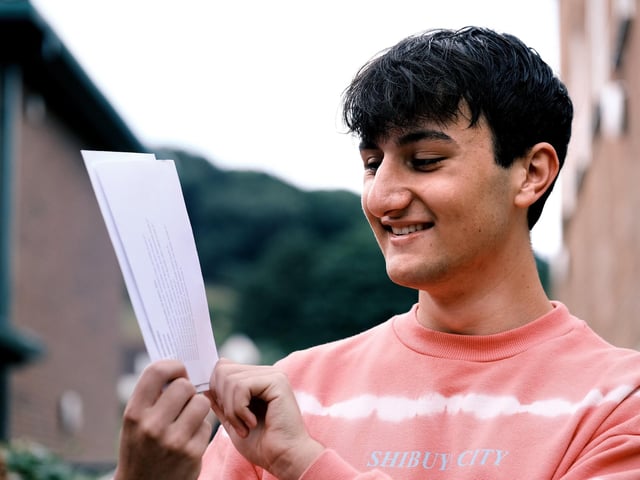 Kai Briggs reads his results.
Kai's successful A-level results will see him go on to read Modern and Medieval Languages at Cambridge University (specifically Spanish and Russian).