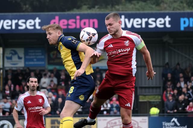 Boro skipper Bailey Gooda challenges for a header.